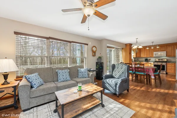 a living room with furniture and a large window