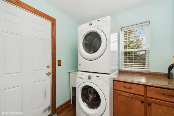 a view of a hallway with washer and dryer