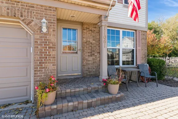 a view of a house with outdoor seating