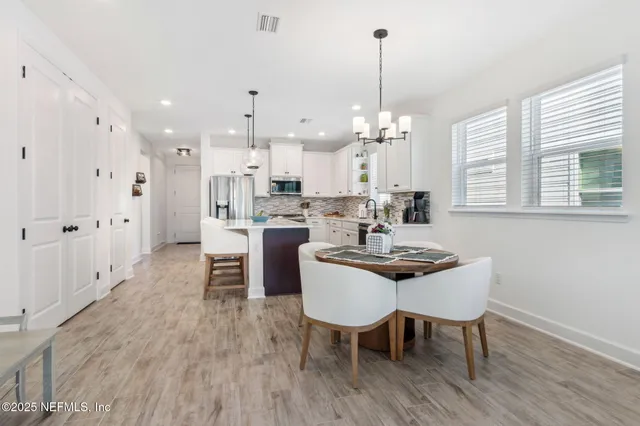 a bed room with a bed and a mirror