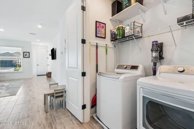 a view of deck with chairs and wooden fence