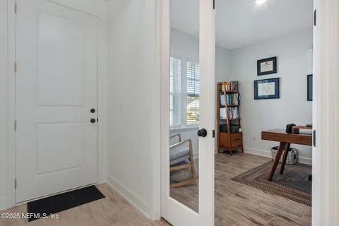 a living room with furniture pool table and a flat screen tv