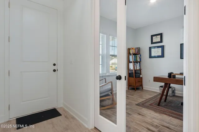a living room with furniture pool table and a flat screen tv