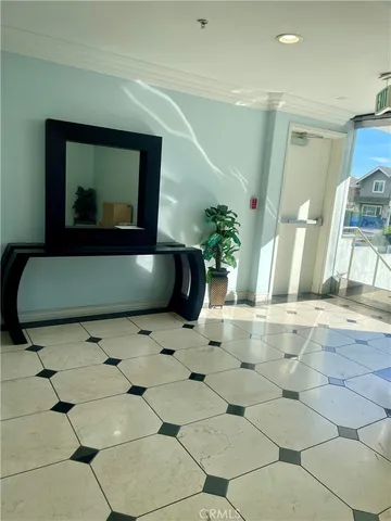 a living room with a black white checkered floor