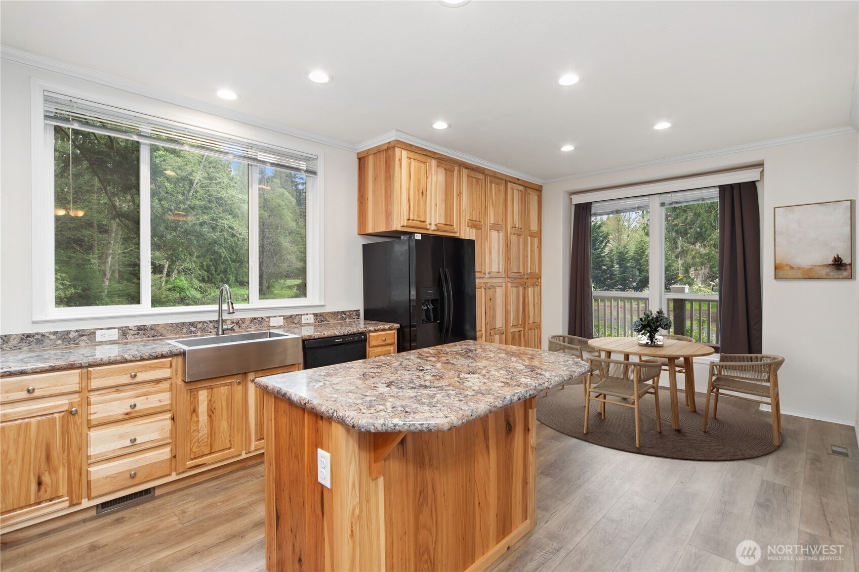 290 Werner Road Port Ludlow, WA 98365 - Photo 14 of 40 a view of a kitchen with granite countertop kitchen island wooden floors and stainless steel appliances