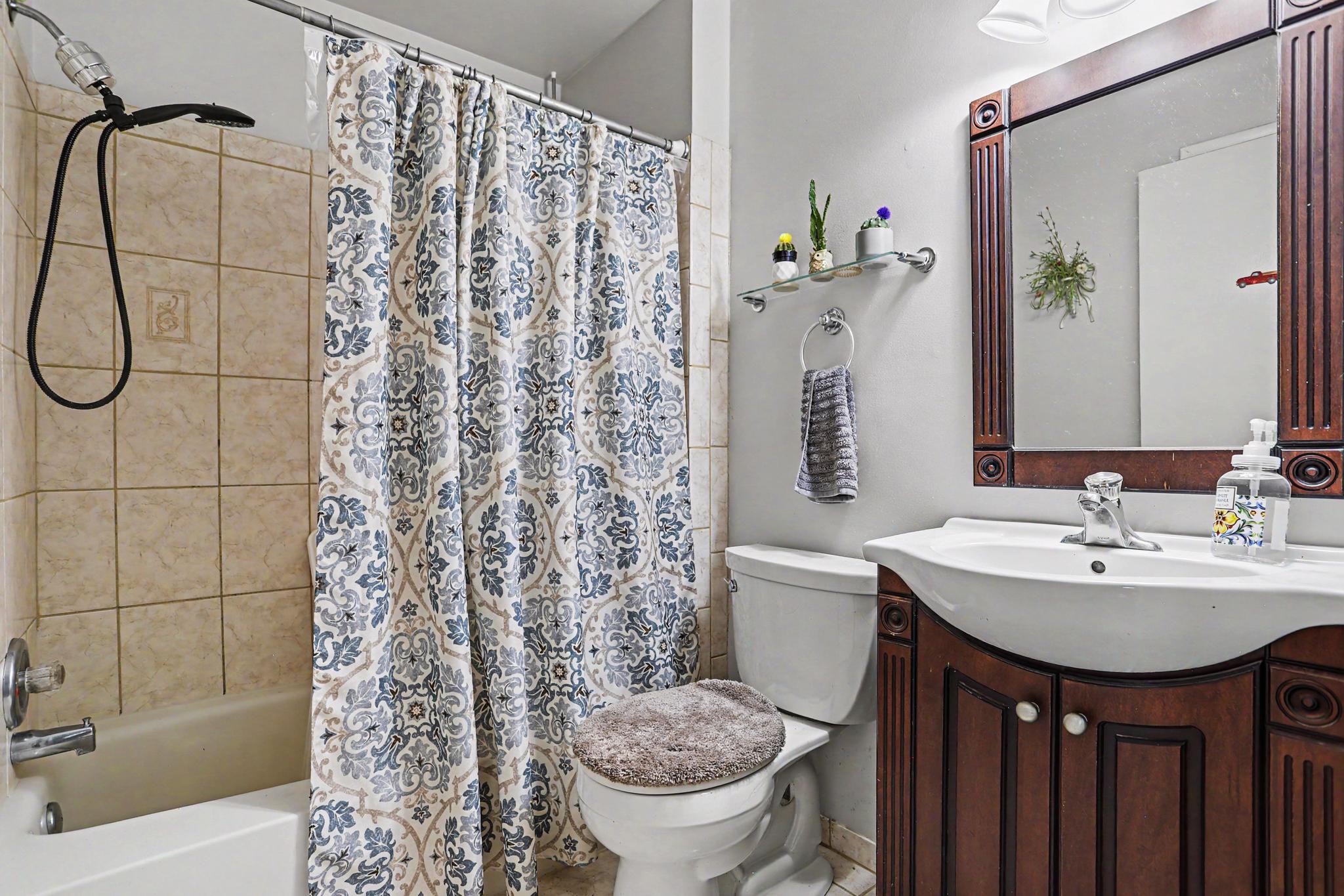 2226 Harney Road Littlestown, PA 17340 - Photo 22 of 40 a bathroom with a sink a toilet and shower