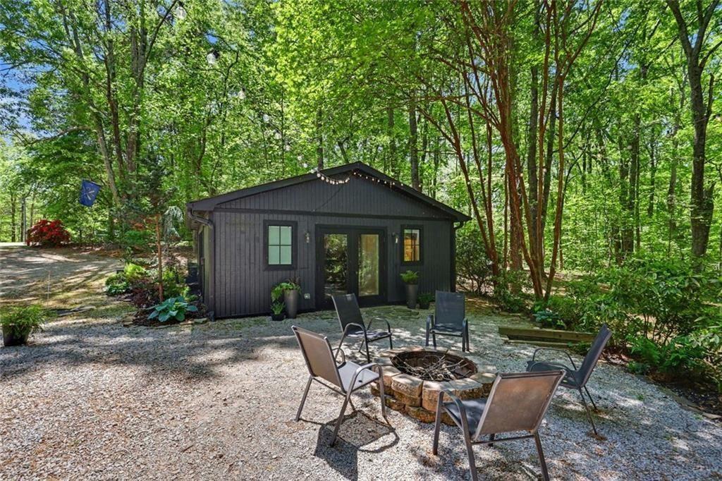 159 Manor Oak Trail Toccoa, GA 30577 - Photo 46 of 68 a view of a house with backyard sitting area and garden