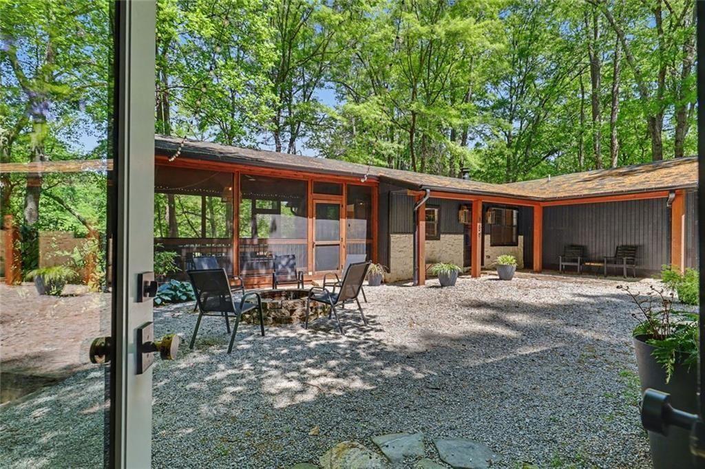 159 Manor Oak Trail Toccoa, GA 30577 - Photo 54 of 68 a view of a house with backyard sitting area and garden