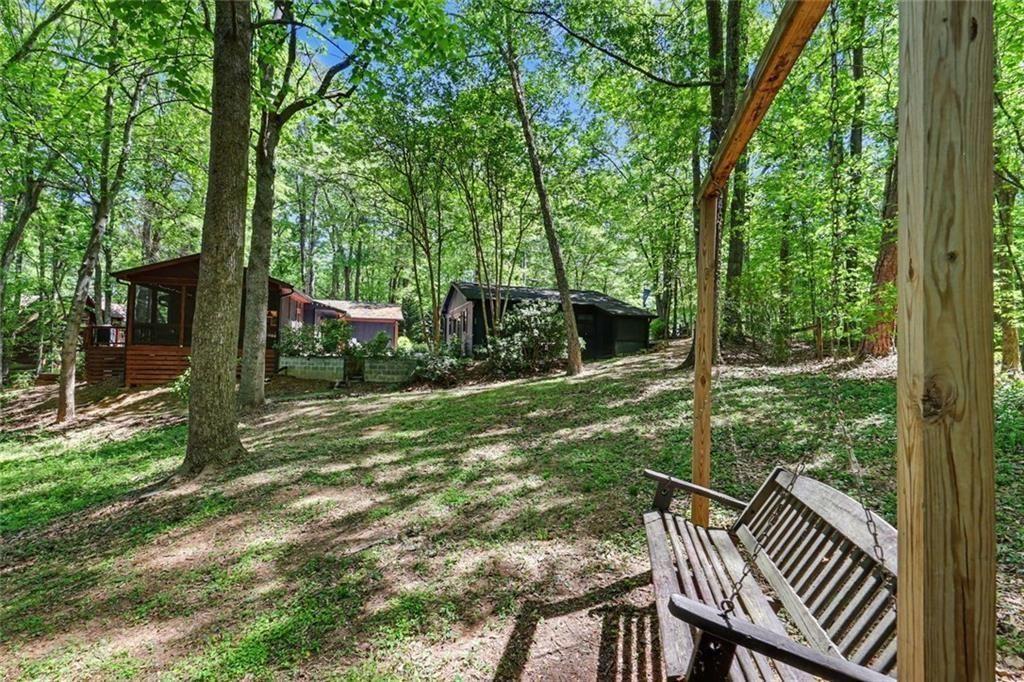 159 Manor Oak Trail Toccoa, GA 30577 - Photo 56 of 68 a view of backyard with green space and porch