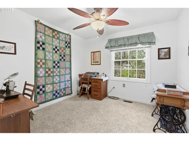 a bedroom with furniture and a window