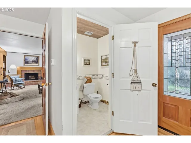 a picture of a bathroom with a tub sink and mirror