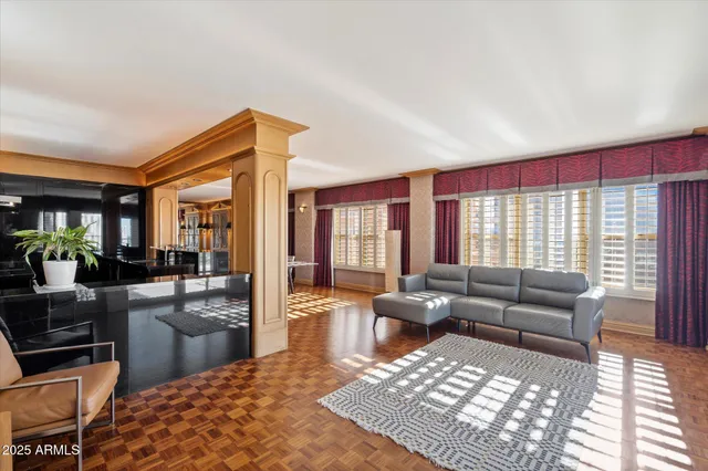 a living room with furniture and a rug