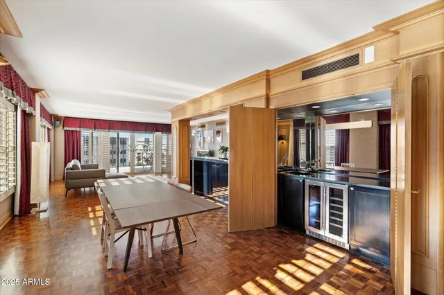 a kitchen with stainless steel appliances granite countertop a refrigerator a stove and a wooden cabinets