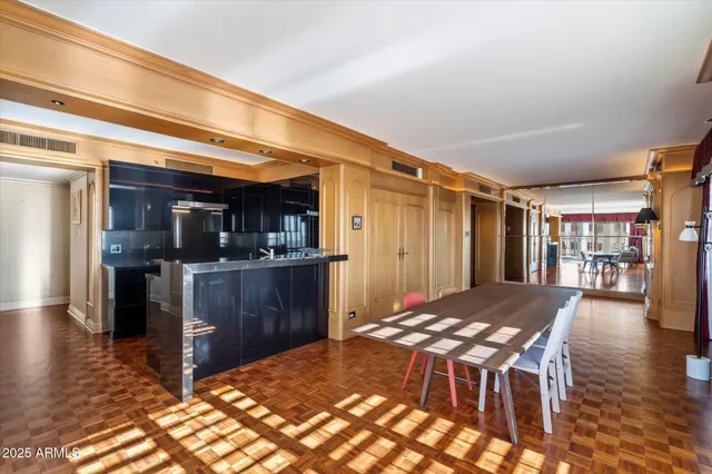 a view of kitchen with furniture and wooden floor