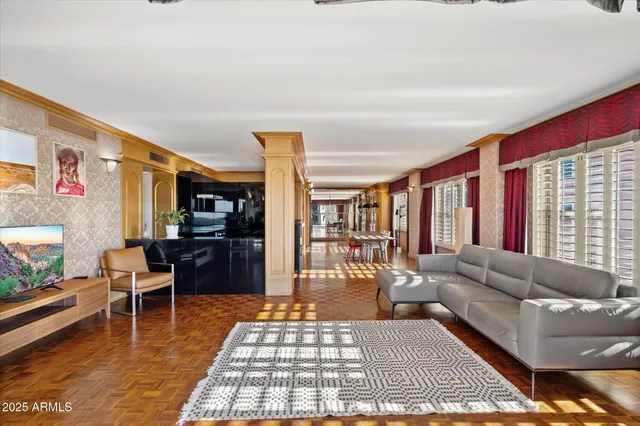 a living room with furniture and a rug