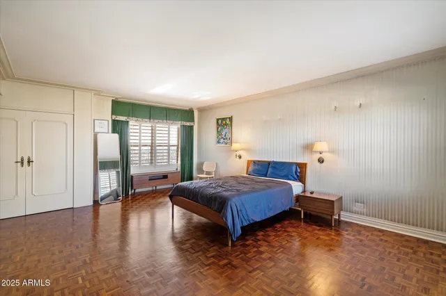 a bedroom with a bed and a window