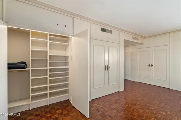 a view of closet area with empty racks