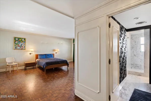 a bedroom with furniture and a window