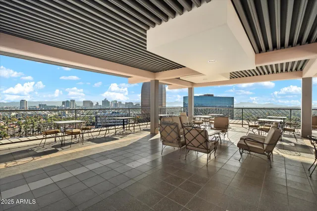 an outdoor space with patio furniture and a potted plant