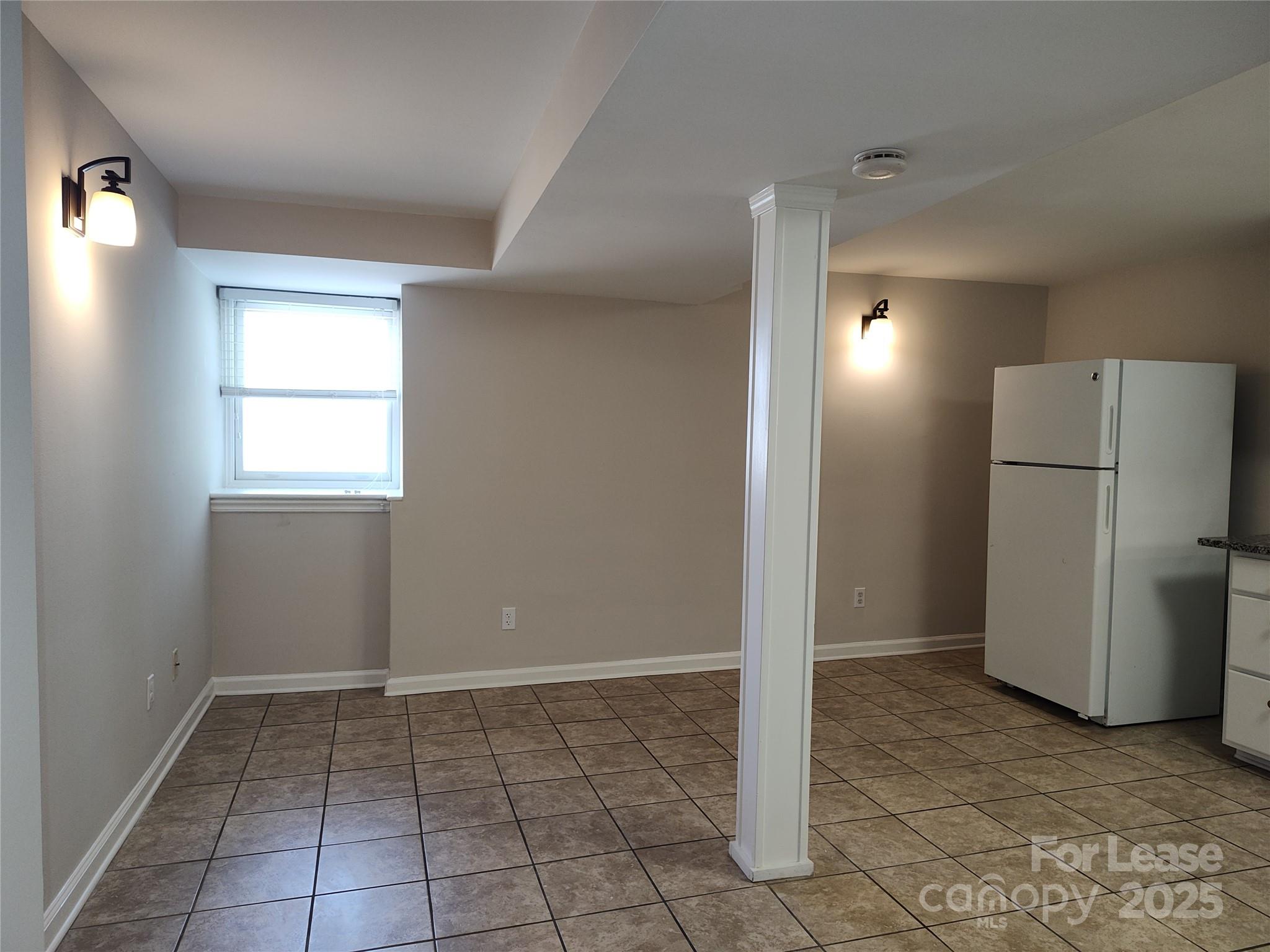 340 Hollis Road Charlotte, NC 28209 - Photo 8 of 21 an empty room with a door