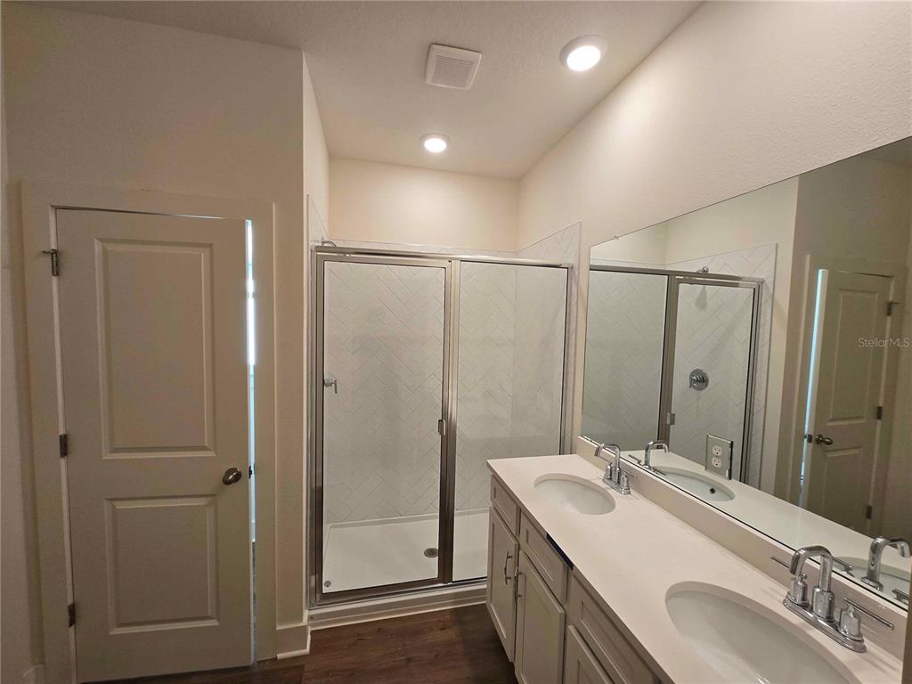 3352 Daybreak Run Loop Spring Hill, FL 34609 - Photo 8 of 15 a bathroom with a double vanity sink mirror and double