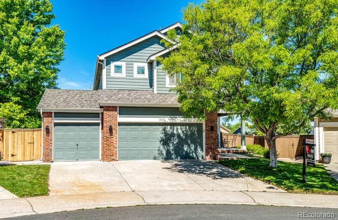 2016 West Ashwood Place Highlands Ranch, CO 80129 - Photo 1 of 40 a front view of a house with a yard and garage