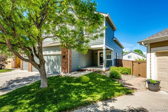 2016 West Ashwood Place Highlands Ranch, CO 80129 - Photo 2 of 40 a front view of a house with a garden