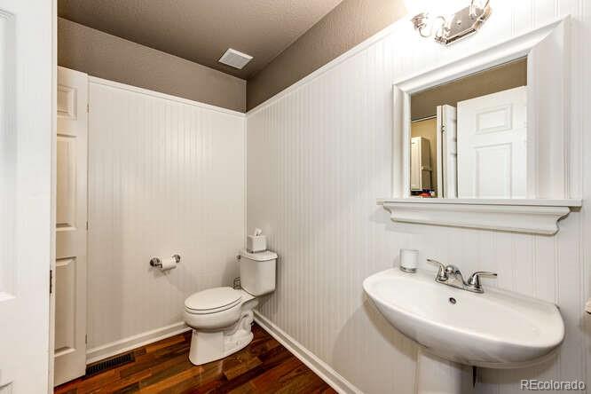 2016 West Ashwood Place Highlands Ranch, CO 80129 - Photo 23 of 40 a bathroom with a toilet sink and mirror