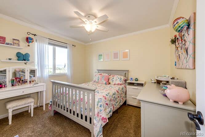 2016 West Ashwood Place Highlands Ranch, CO 80129 - Photo 30 of 40 a bedroom with a bed and a window