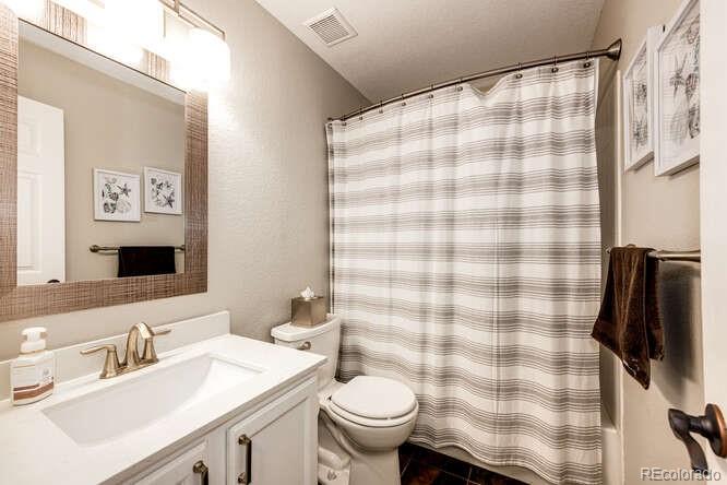 2016 West Ashwood Place Highlands Ranch, CO 80129 - Photo 31 of 40 a bathroom with a sink toilet and shower