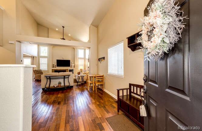 2016 West Ashwood Place Highlands Ranch, CO 80129 - Photo 4 of 40 a living room with furniture and a flat screen tv