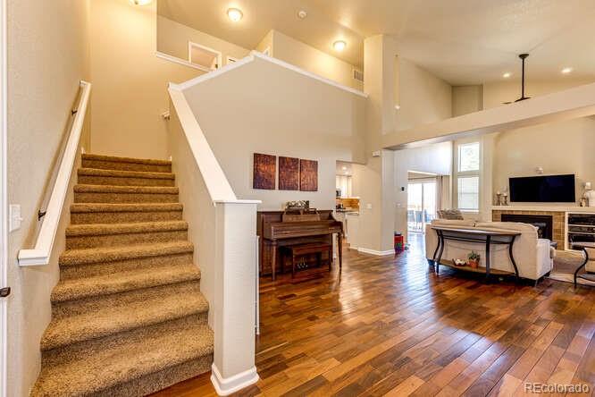 2016 West Ashwood Place Highlands Ranch, CO 80129 - Photo 5 of 40 a living room with furniture and a flat screen tv