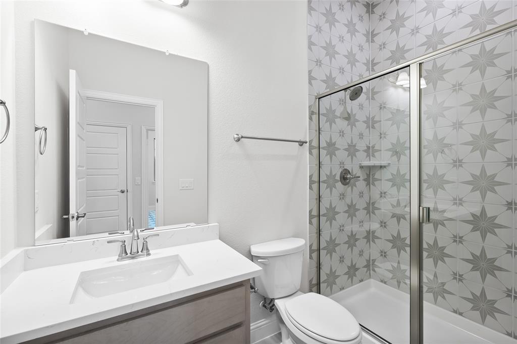 3 Beech Street Van Alstyne, TX 75495 - Photo 13 of 35 a bathroom with a sink toilet and shower