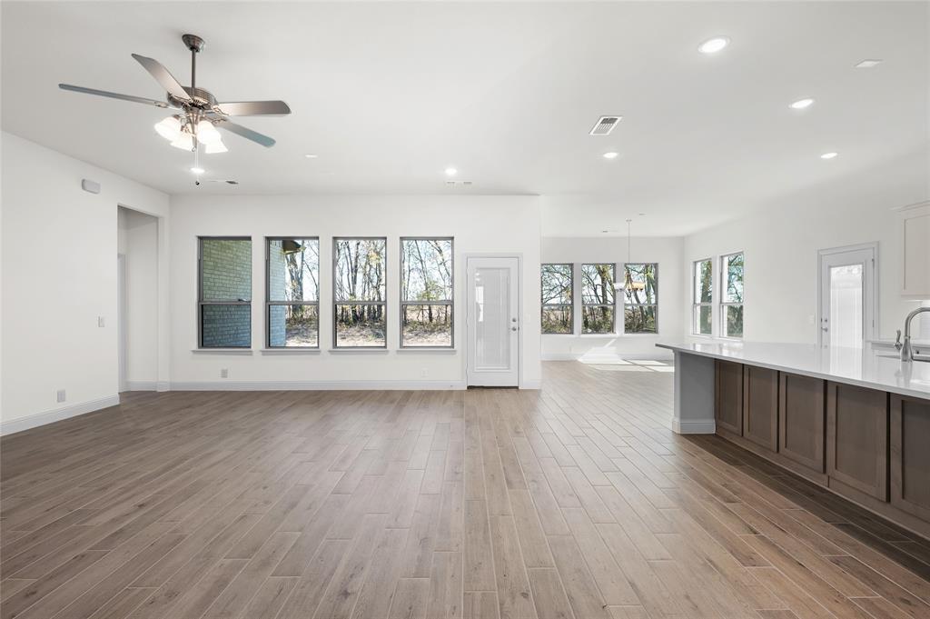 3 Beech Street Van Alstyne, TX 75495 - Photo 20 of 35 a view of an empty room with wooden floor and a window
