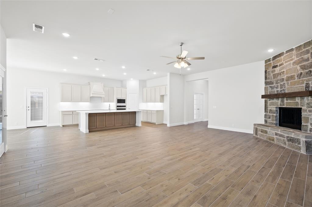 3 Beech Street Van Alstyne, TX 75495 - Photo 22 of 35 a view of a kitchen with furniture and a fireplace