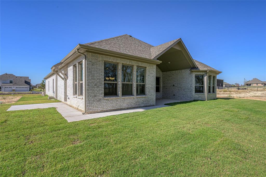 3 Beech Street Van Alstyne, TX 75495 - Photo 31 of 35 a view of a house with a yard and porch