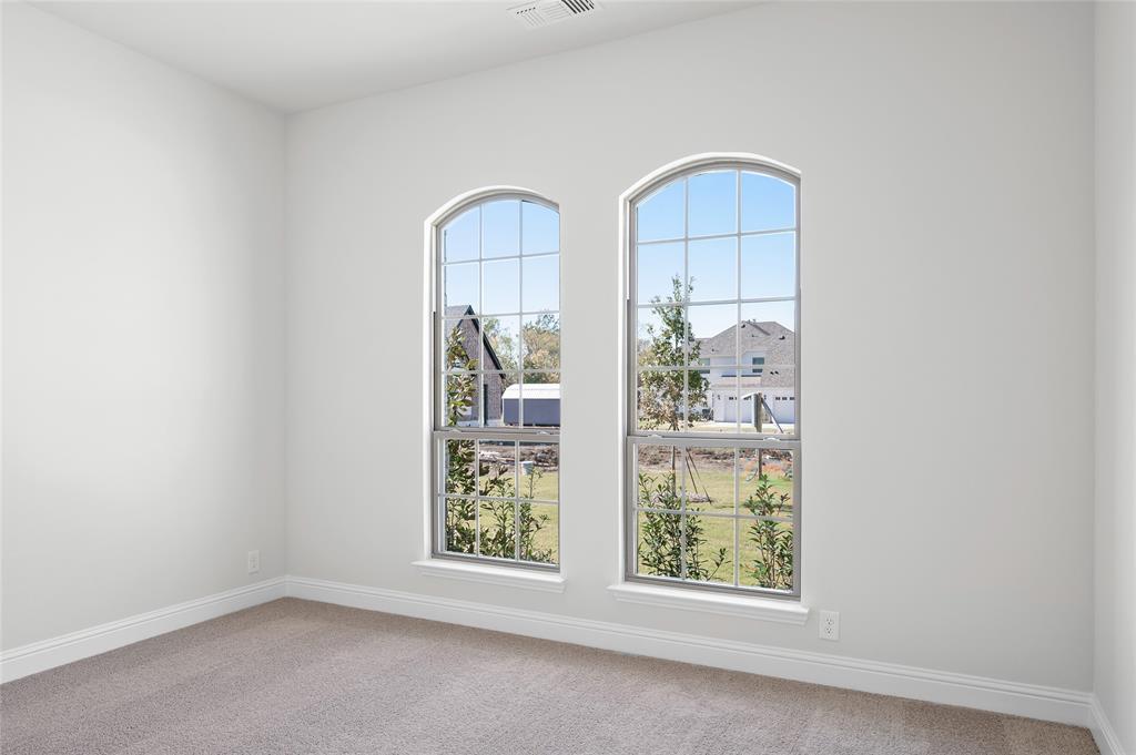 3 Beech Street Van Alstyne, TX 75495 - Photo 9 of 35 an empty room with windows and entrance