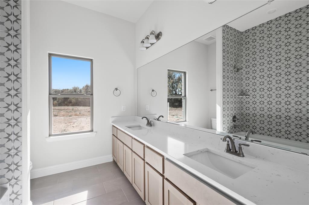 3 Beech Street Van Alstyne, TX 75495 - Photo 10 of 35 a bathroom with a double vanity sink mirror and double