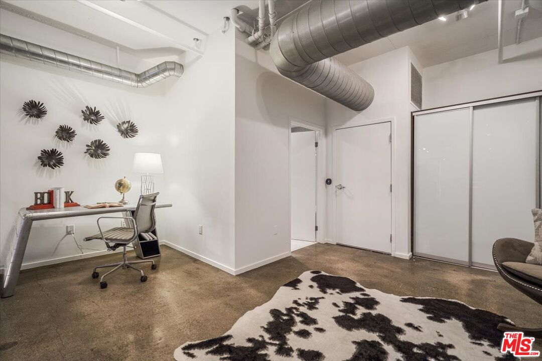510 South Hewitt Street, Unit 106 Los Angeles, CA 90013 - Photo 13 of 26 a view of a workspace with furniture