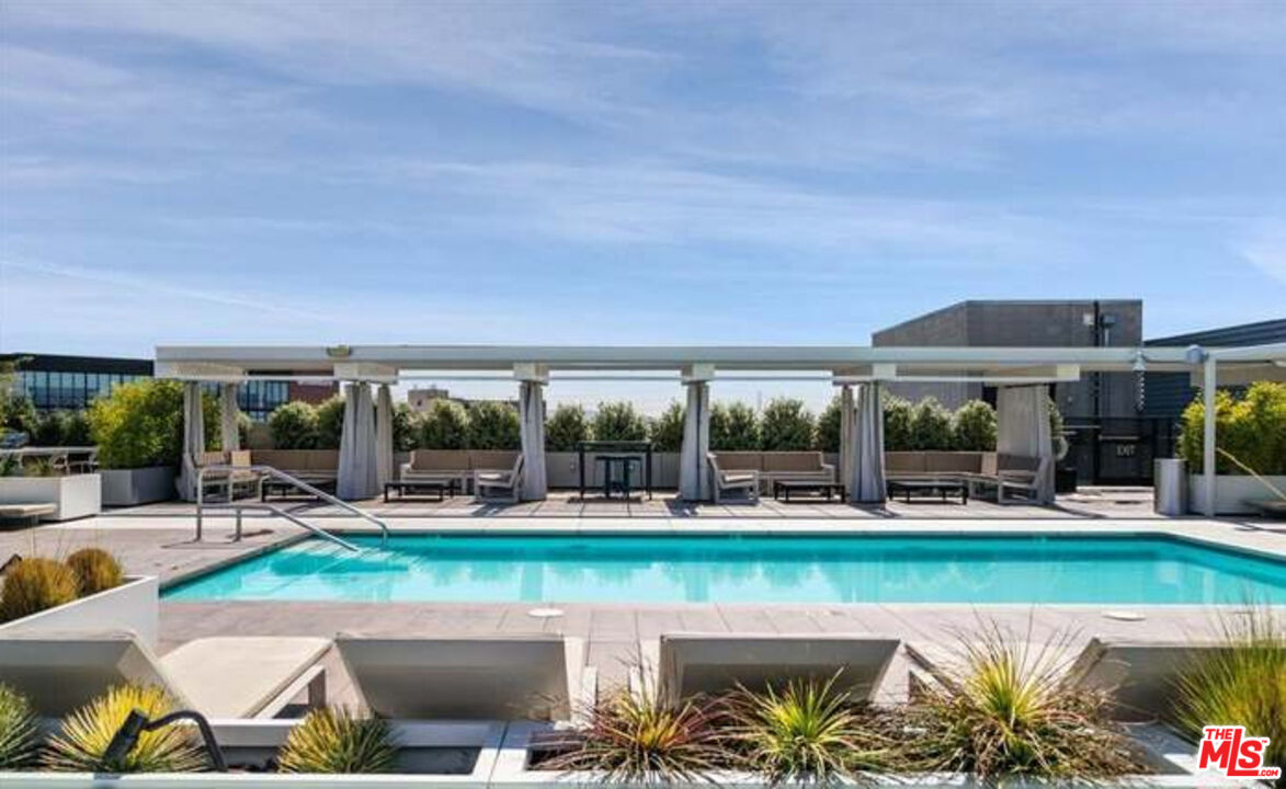 510 South Hewitt Street, Unit 106 Los Angeles, CA 90013 - Photo 18 of 26 a view of a swimming pool and outdoor seating