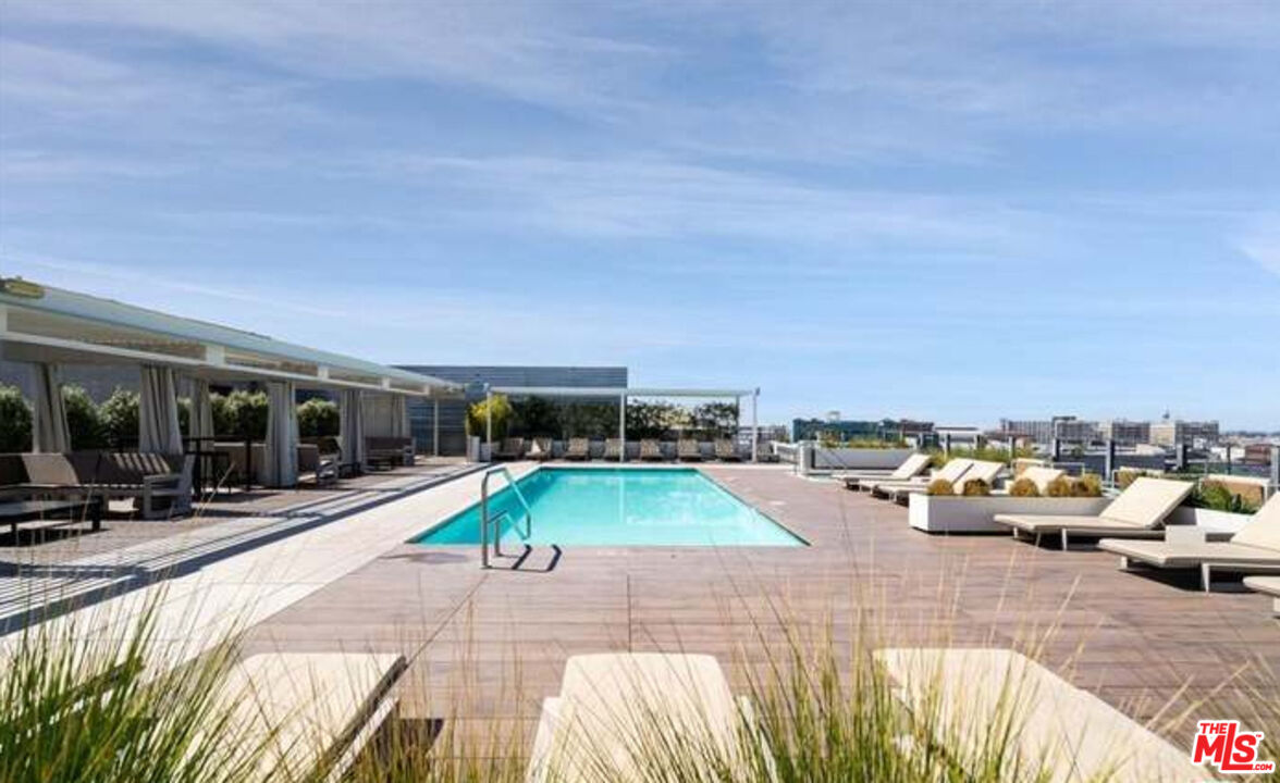 510 South Hewitt Street, Unit 106 Los Angeles, CA 90013 - Photo 19 of 26 a view of a swimming pool with furniture