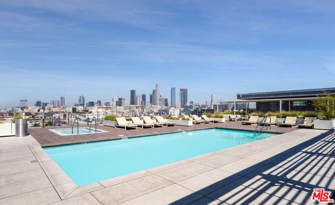 510 South Hewitt Street, Unit 106 Los Angeles, CA 90013 - Photo 25 of 26 a view of a swimming pool and lounge chairs
