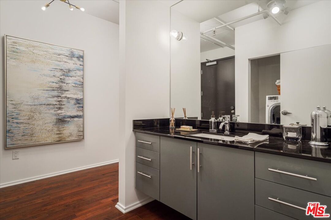 510 South Hewitt Street, Unit 106 Los Angeles, CA 90013 - Photo 8 of 26 a bathroom with a double vanity sink and a mirror