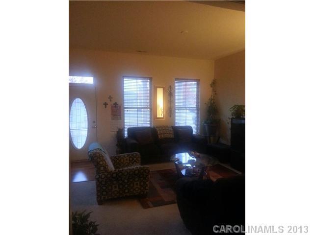 1312 Rising Oak Drive Charlotte, NC 28206 - Photo 3 of 4 a living room with furniture and a fireplace
