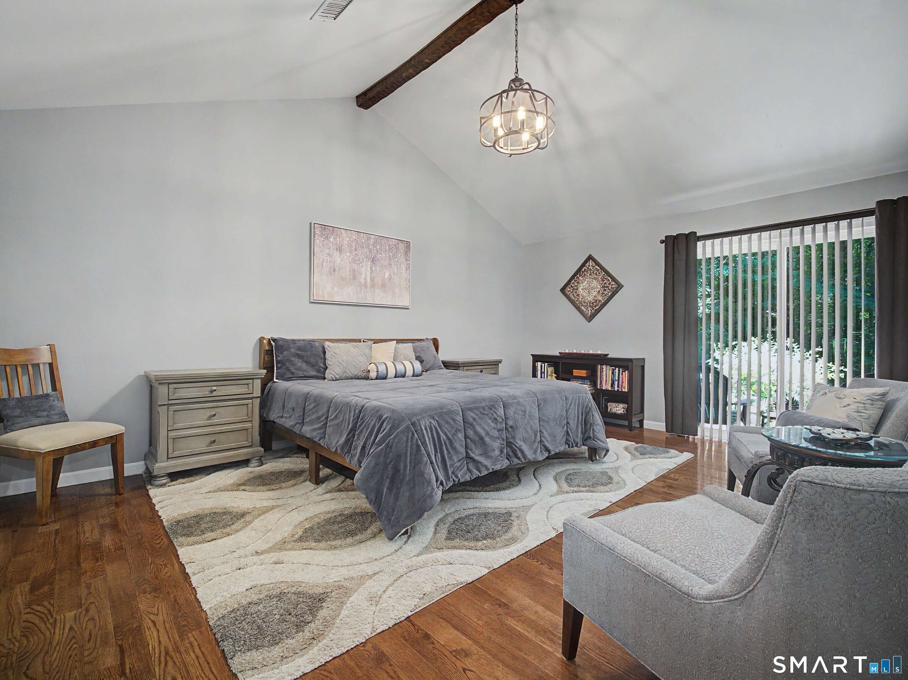 270 Bound Line Road Wolcott, CT 06716 - Photo 22 of 40 a bedroom with a bed and a chandelier
