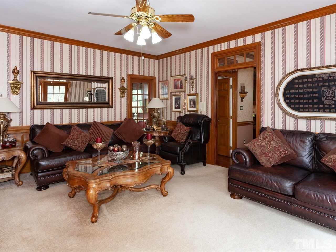 701 Presnell Court Raleigh, NC 27615 - Photo 11 of 24 a living room with furniture ceiling fan and a window