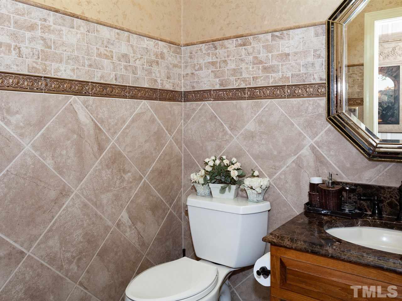 701 Presnell Court Raleigh, NC 27615 - Photo 12 of 24 a bath room with a toilet and a shower