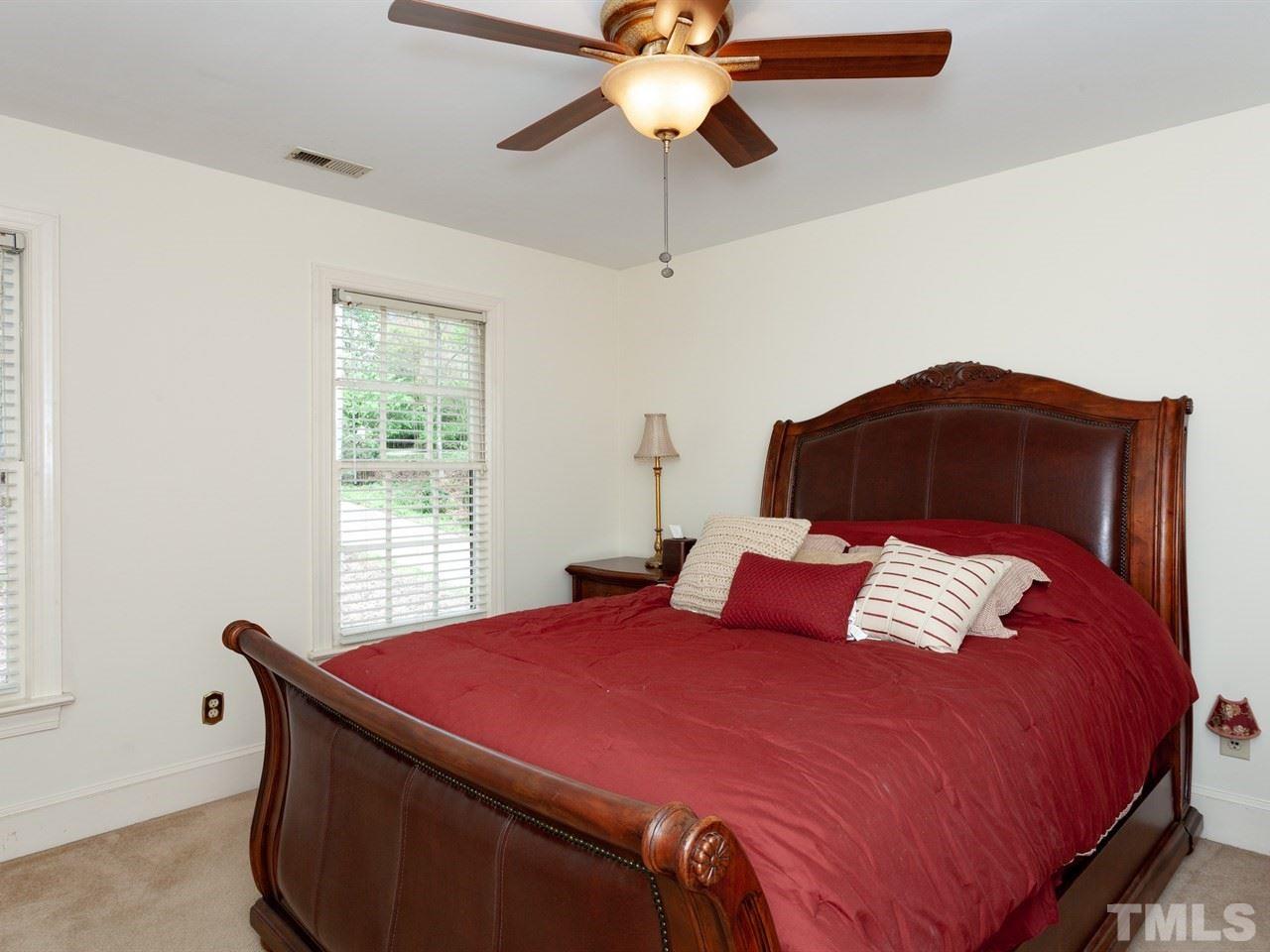 701 Presnell Court Raleigh, NC 27615 - Photo 18 of 24 a bedroom with a bed and a window