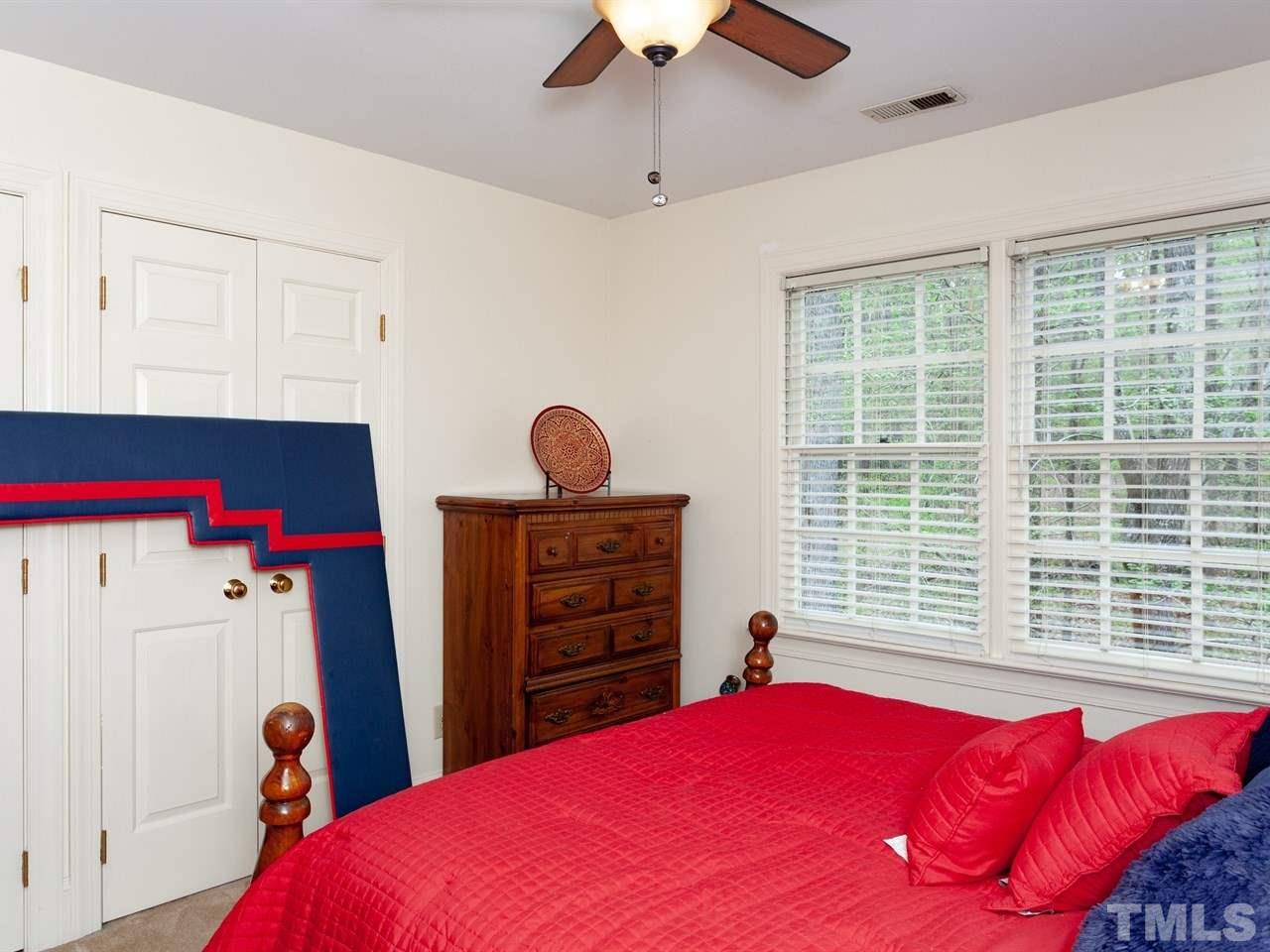 701 Presnell Court Raleigh, NC 27615 - Photo 19 of 24 a bedroom with a bed and a window