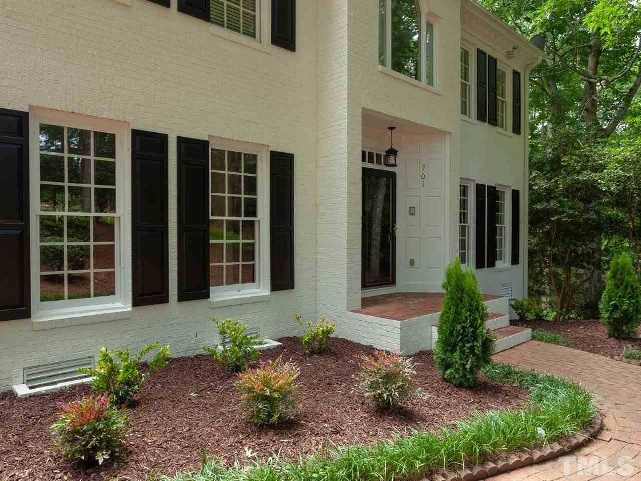 701 Presnell Court Raleigh, NC 27615 - Photo 3 of 24 a front view of a house with garden